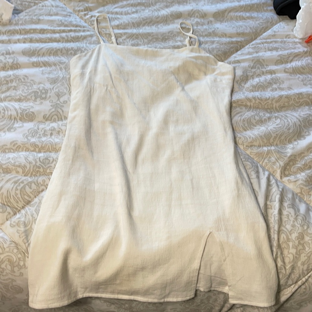 White mini dress with a little cute slit at the bottom